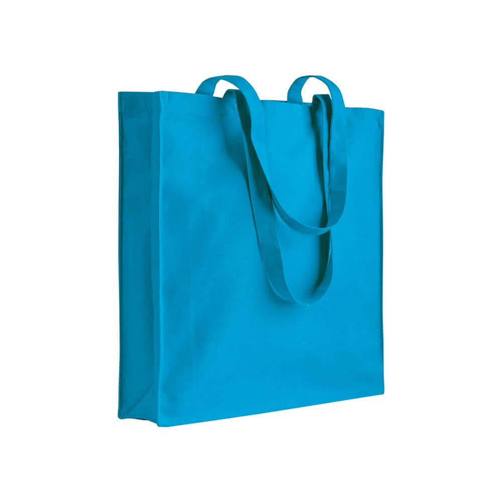 light blue clor cotton bag with long handles